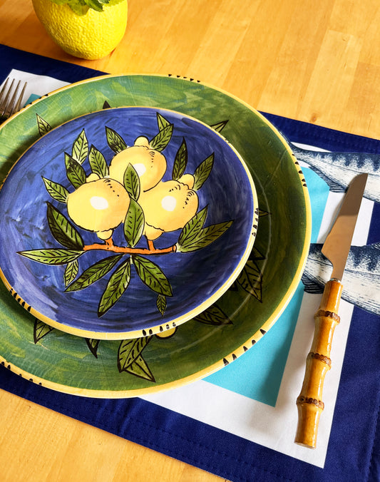 Decorative ceramic plate with lemon design on a table setting