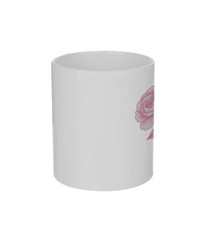 White mug with a pink floral design on a white background